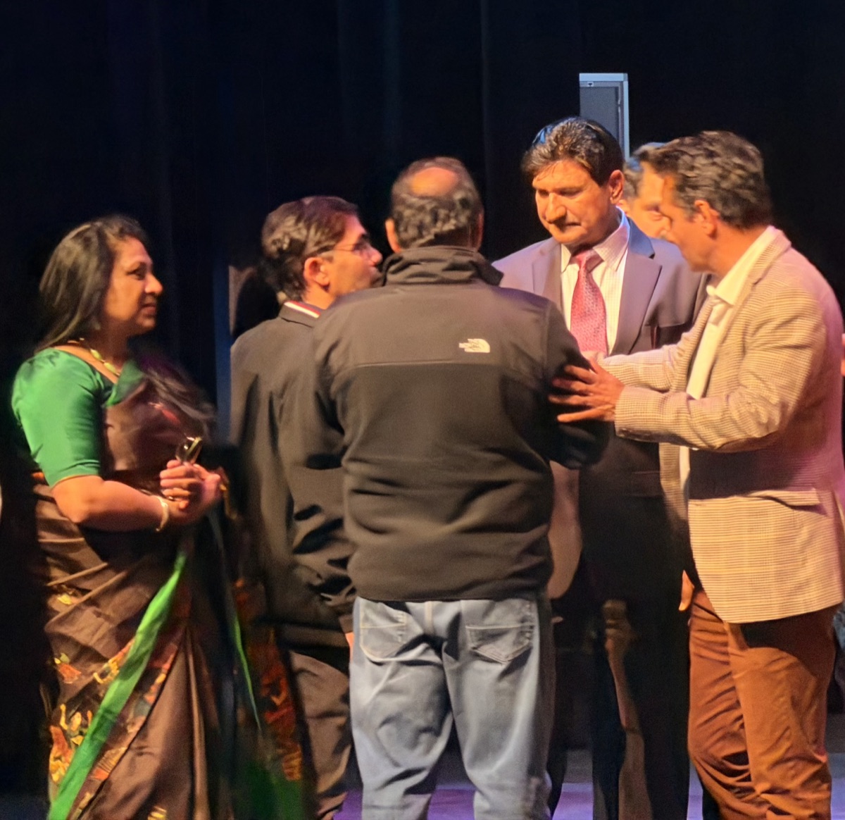 Shivraj Singh networking backstage with community members at an event