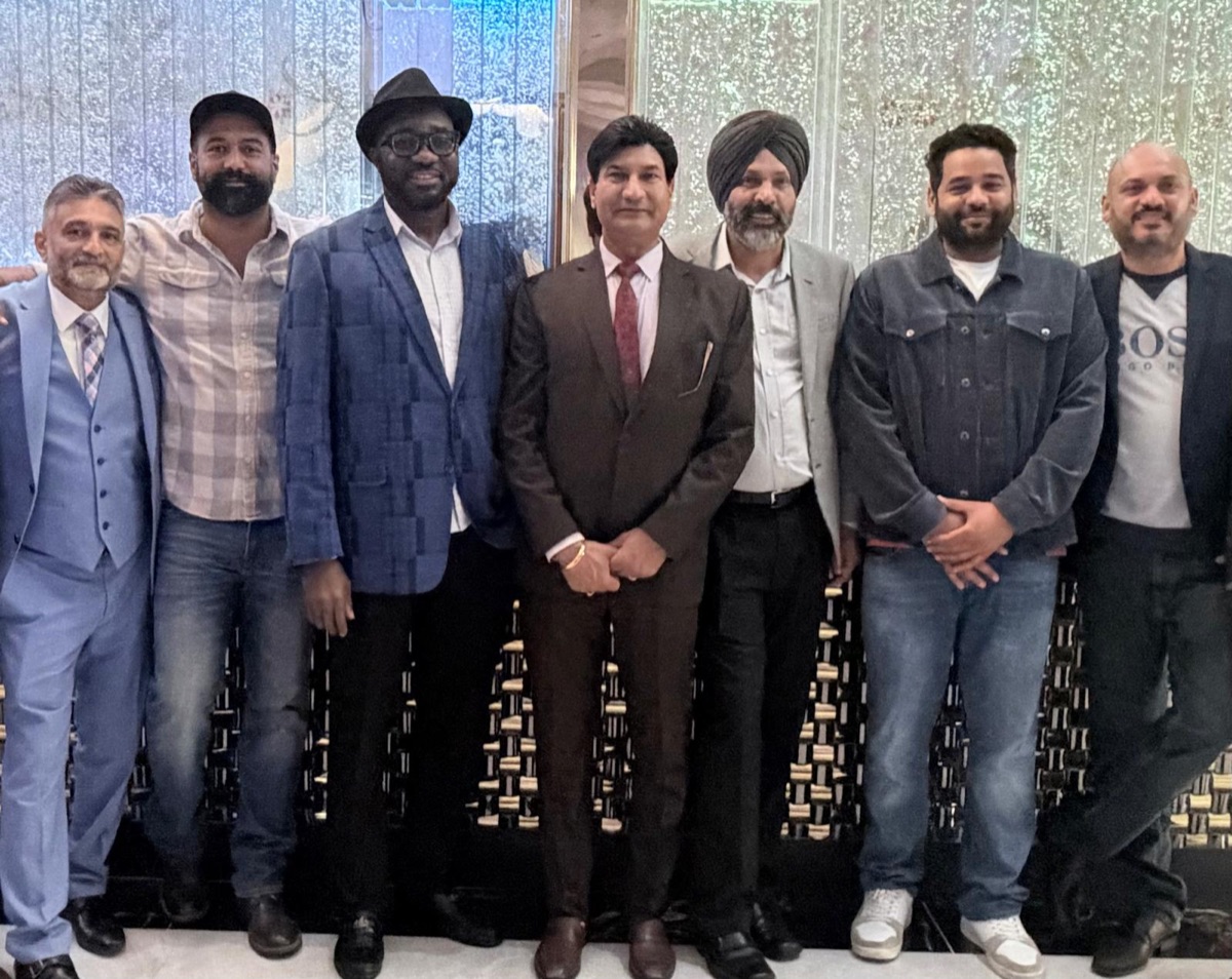 Shivraj Singh with a diverse group of community members at a local event