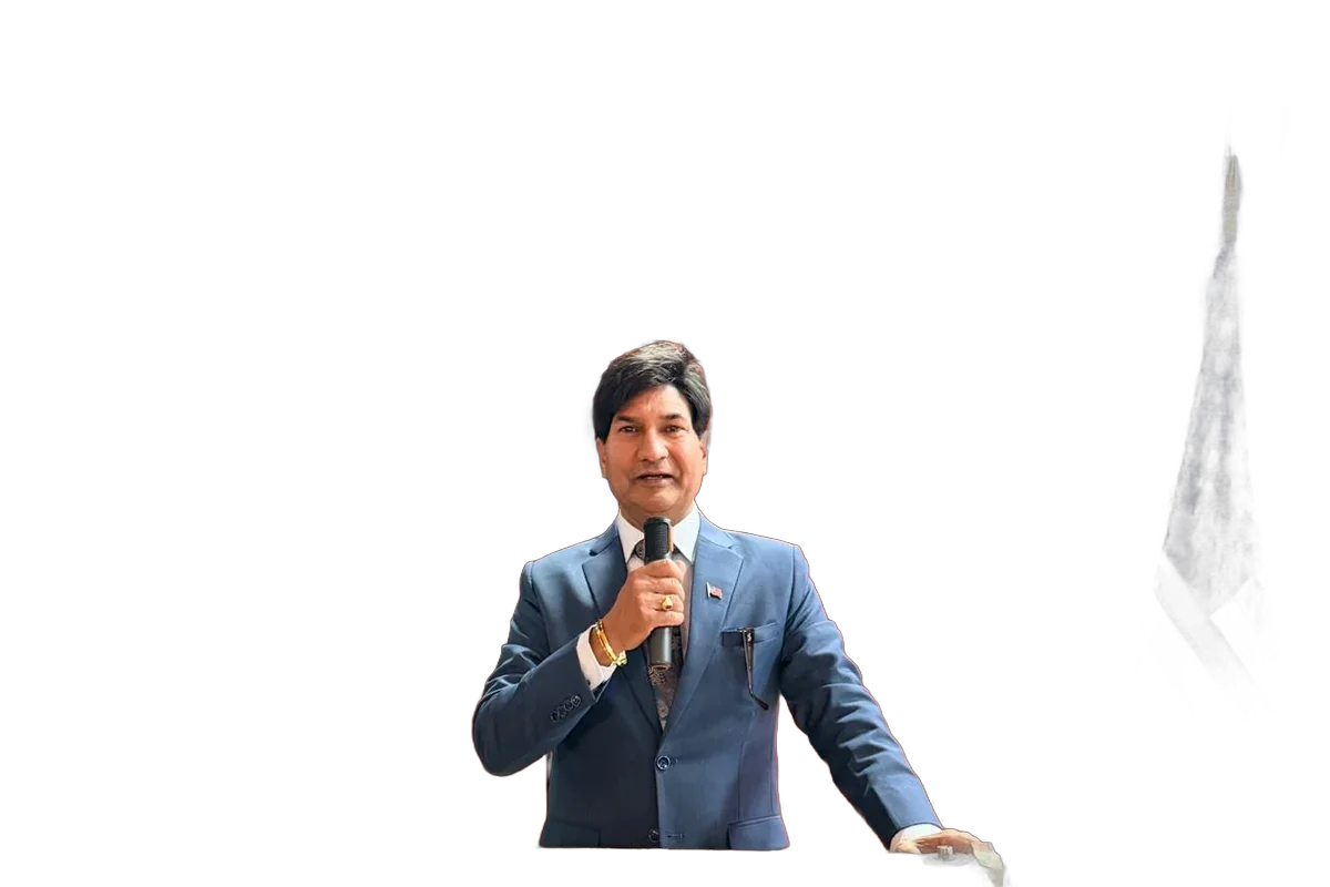 Shivraj Singh speaking at a community event with American flag backdrop